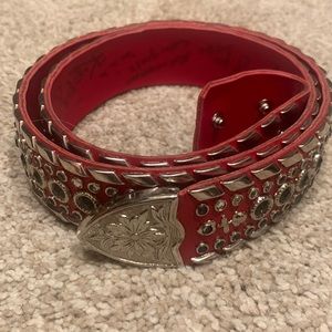 Kippy’s red and silver belt. Used.